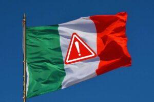 Bandiera italiana con sopra il segnale di pericolo